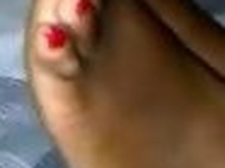 Swarthy red long toenail